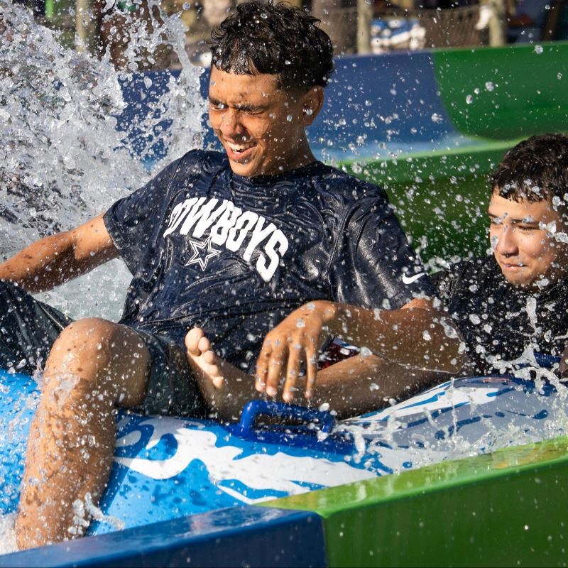 Boys on a waterslide