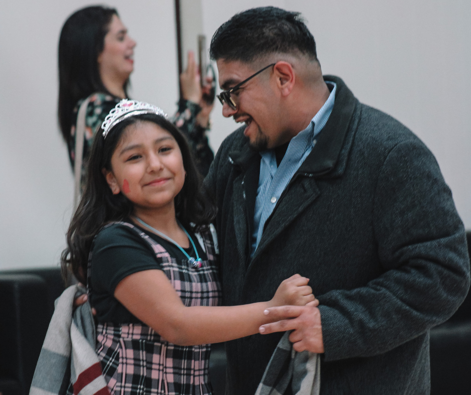 Man and daughter dancing