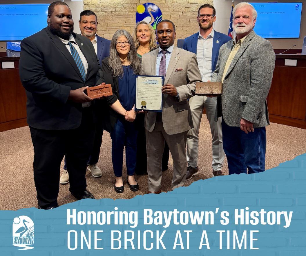 Council with bricks and proclamation pictured